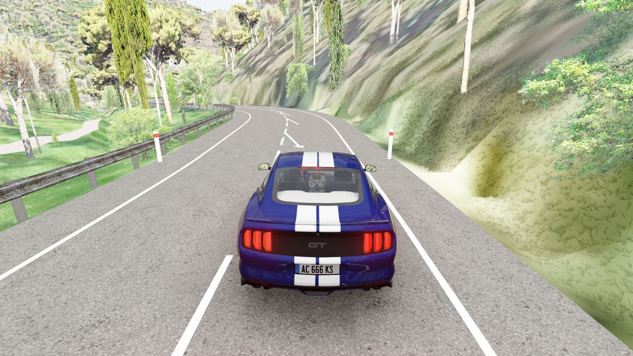 Unretouched Assetto Corsa screenshot on the generated CV-25: a mountain bend with warning arrows, guard rail, marker posts and pines.